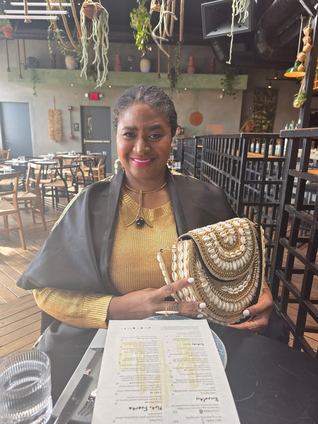 Customer photo review of Bahari Luxe Cowry Shell Clutch