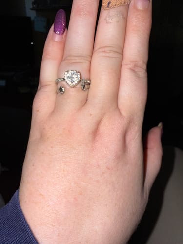 Reviewer's hand wearing the sparkling, heart-shaped Forever In My Heart Urn Ring.