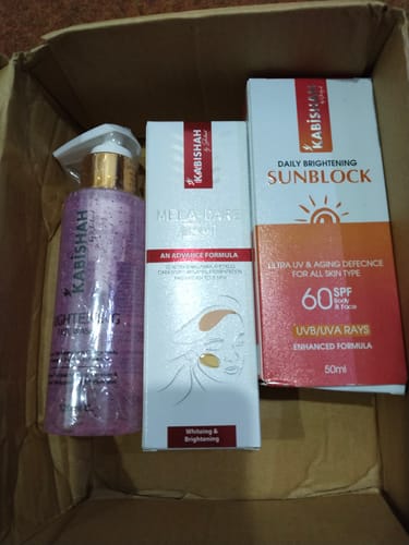 Reviewer's Melasma Bundle, showing the face wash, cream, and sunblock, inside the open delivery box.