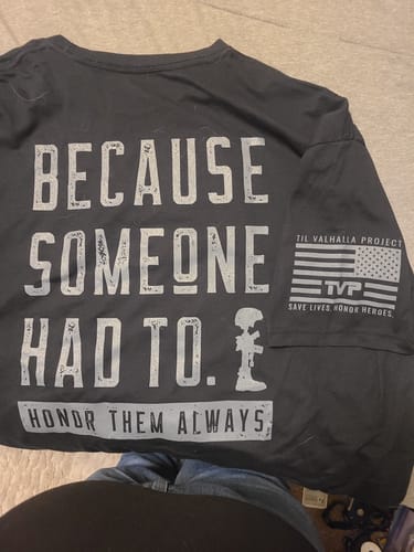 Customer's black T.V.P. Elite shirt with back text 'BECAUSE SOMEONE HAD TO. HONOR THEM ALWAYS' and a soldier's cross graphic.