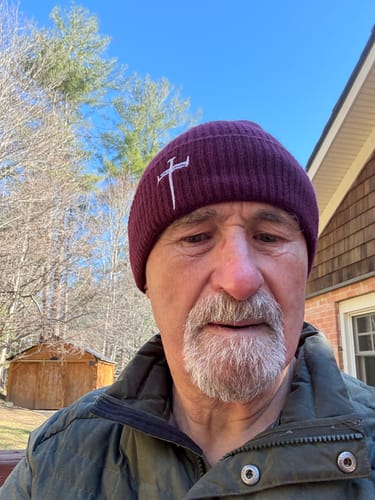 Customer who reviewed Blue Cannatine™, shown in a selfie outdoors on a sunny day.