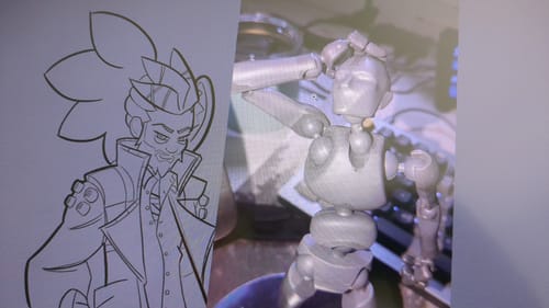 Reviewer's dark Stickybones figure posed next to a character sketch, used as a drawing reference.