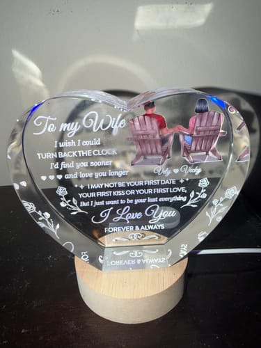 Reviewer's personalized Crystal Heart LED, lit from its wooden base with a soft blue light.