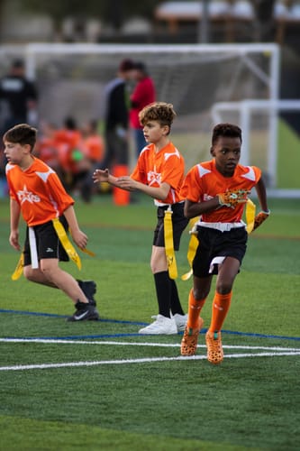 Customer photo review of The Flintstones "Bedrock Blitz" Football Cleats - Quantum Speed by Phenom Elite