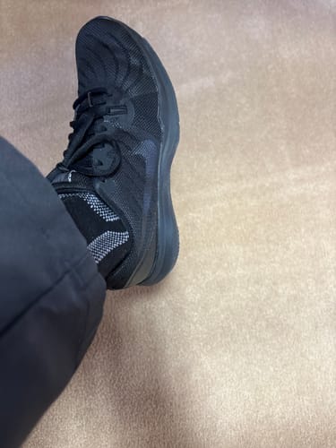 Customer showing the black Alpaca Sock with a grey pattern slightly slipped down inside a black shoe.