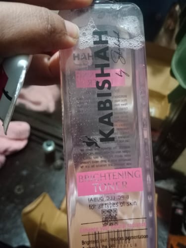 Close-up of a customer holding the bottle of Kabishah Brightening Toner.