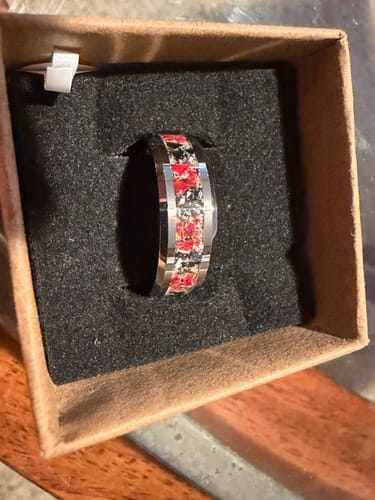 Customer's Tungsten Opal Ring with a red and black inlay, displayed in its original box.