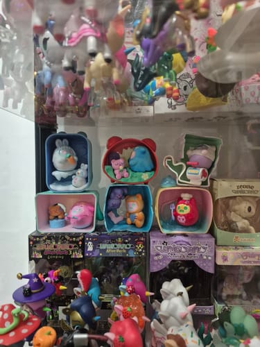 Customer's collection of ShinWoo Ghost at Home Series figurines displayed in their colorful diorama boxes on a shelf.