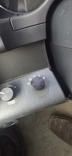 Customer's close-up of the black Powerstroke CAC SOTF Switch installed in a vehicle's dashboard, with the dial set to 4.