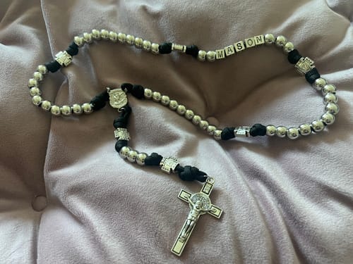 Customer's personalized Battle Prayer Rosary with silver-toned beads, showing the name 'MASON' spelled out in letter beads.