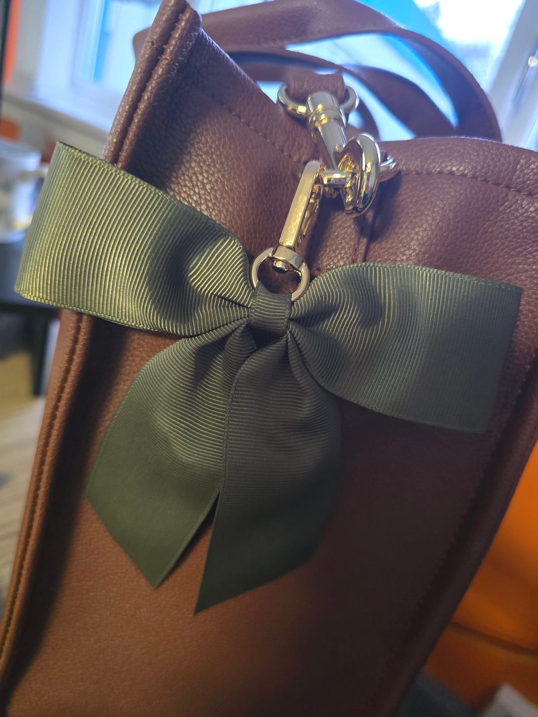 Customer photo review of Eloise Bow keyring Olive Green