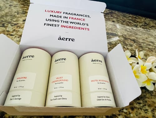 Customer's Pastel Rosewater perfume packaging inside an open àerre box with two other fragrances.