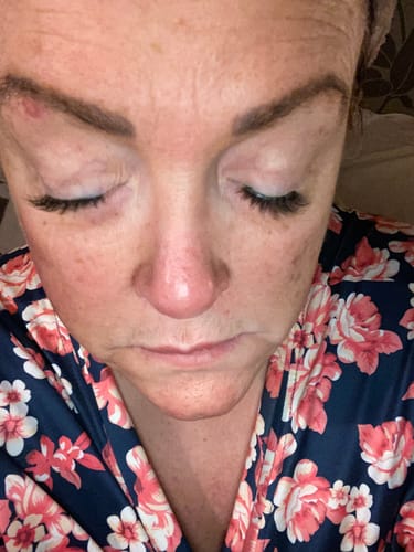 Close-up of a customer with closed eyes, showing the applied Lazy Girl Pre-Glued Half Lashes.
