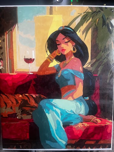 Customer's finished 'A princess at dusk' paint by number project showing a princess on a red couch with a glass of wine.