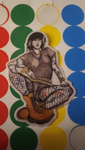 Customer's cut to shape sticker showing an illustrated person with tattoos and boots on a colorful, dotted background.