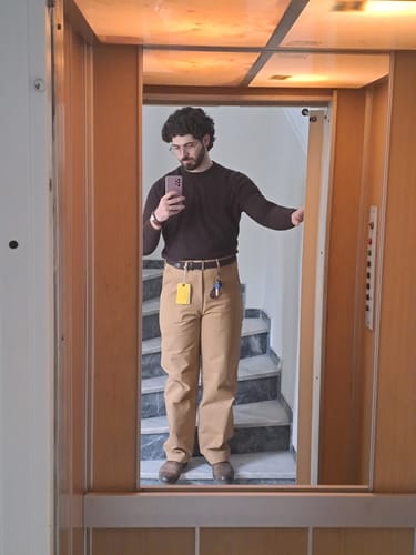 Reviewer showing the full-length, high-rise fit of the Khaki USMC Officer Trousers in a mirror selfie.