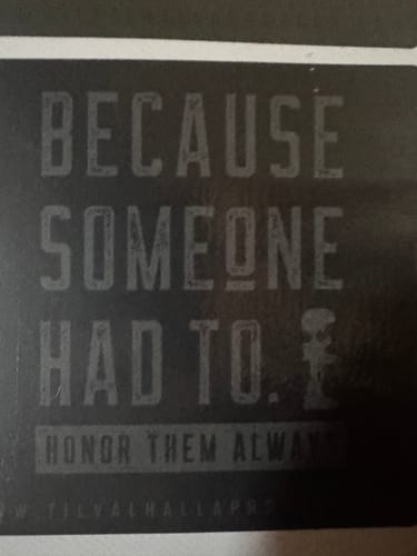 Reviewer's close-up of a T.V.P. design with a soldier and text: 'BECAUSE SOMEONE HAD TO. HONOR THEM ALWAYS'.