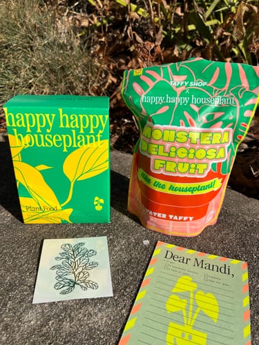 Customer's Plant Food starter kit with its colorful green packaging and extra goodies.
