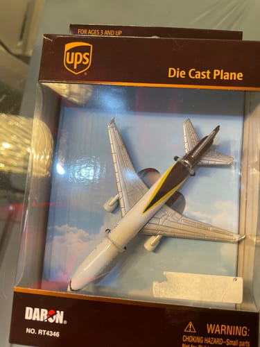 Reviewer's die-cast UPS MD-11 single plane shown new inside its original Daron packaging.
