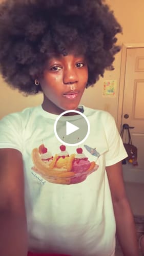 Customer video review of banana split baby tee