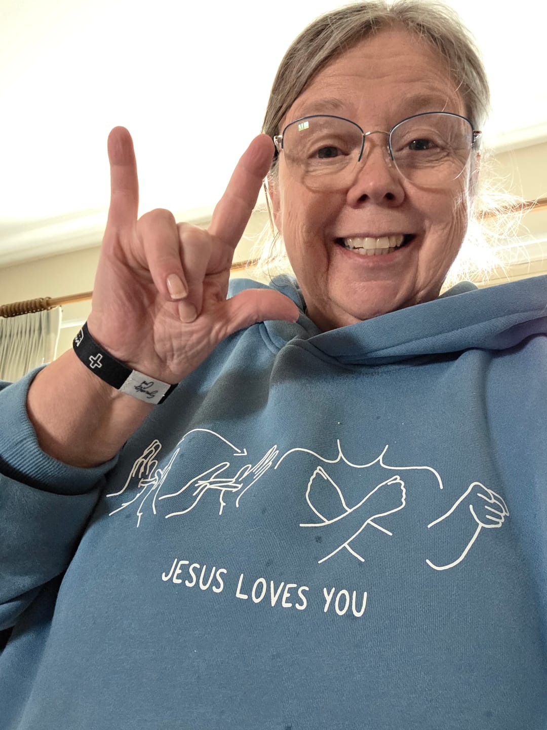 Customer photo review of JESUS LOVES YOU ASL - HEAVYWEIGHT OVERSIZED HOODIE