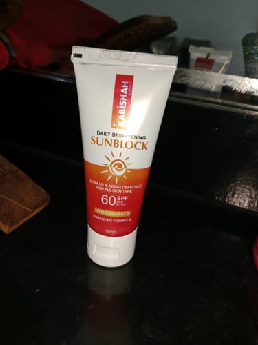 Reviewer's tube of LuminaGuard Daily Brightening Sunblock, showing the slightly damaged packaging mentioned in their review.