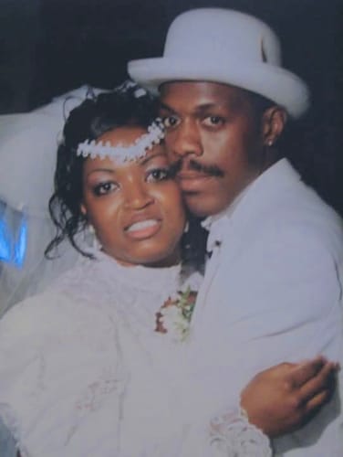 A customer's photo of a couple in wedding attire, posted with a review for a personalized song.