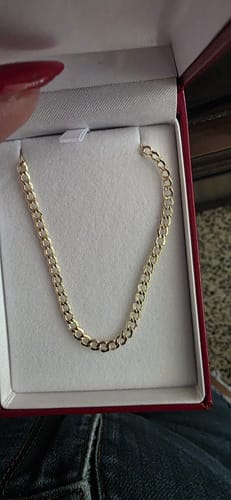 Reviewer holding a jewelry box open to display the 14K Hollow Cuban Curb Chain.