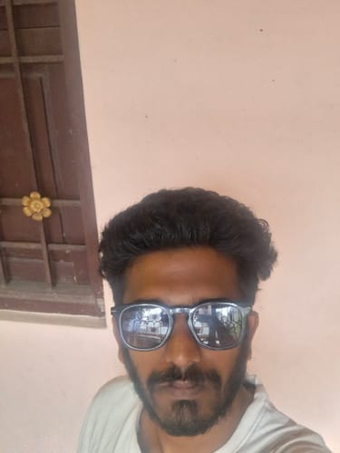 Reviewer taking a close-up selfie wearing the blue Galactic Polarized Wayfarer Sunglasses.