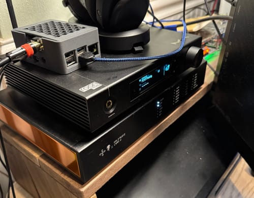 Reviewer's black Matrix Audio Element i DAC/Amp stacked with a Holoaudio Bliss amplifier in a home audio setup.