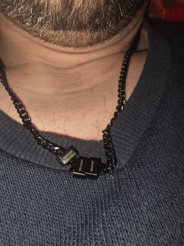 Customer wearing the black Legacy necklace with several engraved beads.