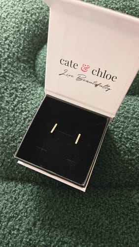 Reviewer's dainty Hayden Linear Drop Earrings displayed in the open Cate & Chloe gift box.