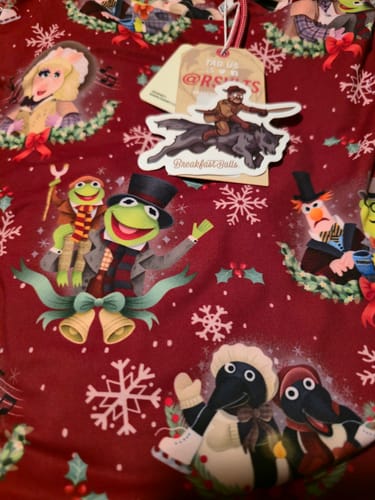 Customer's close-up of the red "Feels Like Christmas" hoodie, showing the detailed print of Muppets characters.