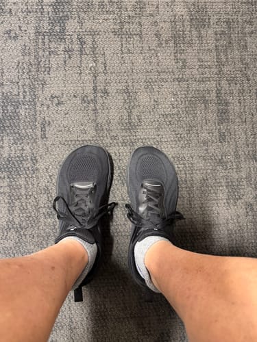 Reviewer's top-down view of the black MUUV Flow pickleball shoes, showing the wide toe box.