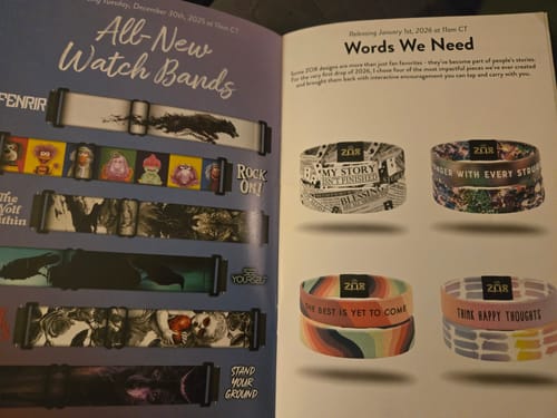 Customer's open January 2026 Booklet showing colorful new watch bands and bracelet designs.