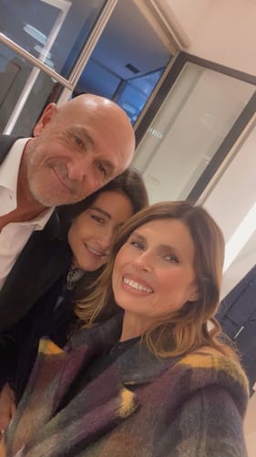 Reviewer smiling with friends, showing smooth skin after using the Glov Micro Infusion System.