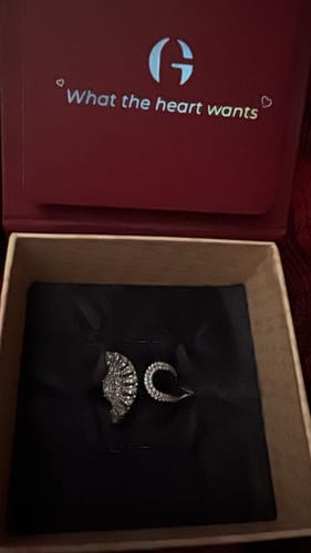 Customer's Silver Peacock Heritage Ring presented in its branded red GIVA box on a black pouch.