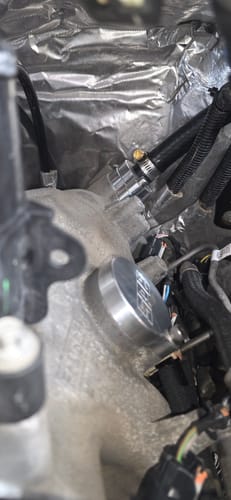Customer's close-up of the silver SPE Motorsport CCV Reroute Kit component installed in an engine bay.