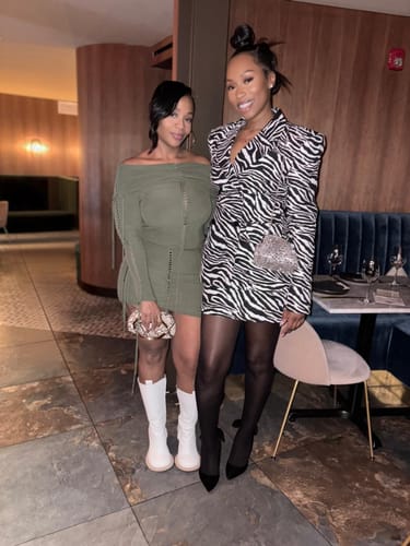 Reviewer standing in a restaurant wearing the Suiting Zebra Jacquard Blazer styled as a fitted dress.