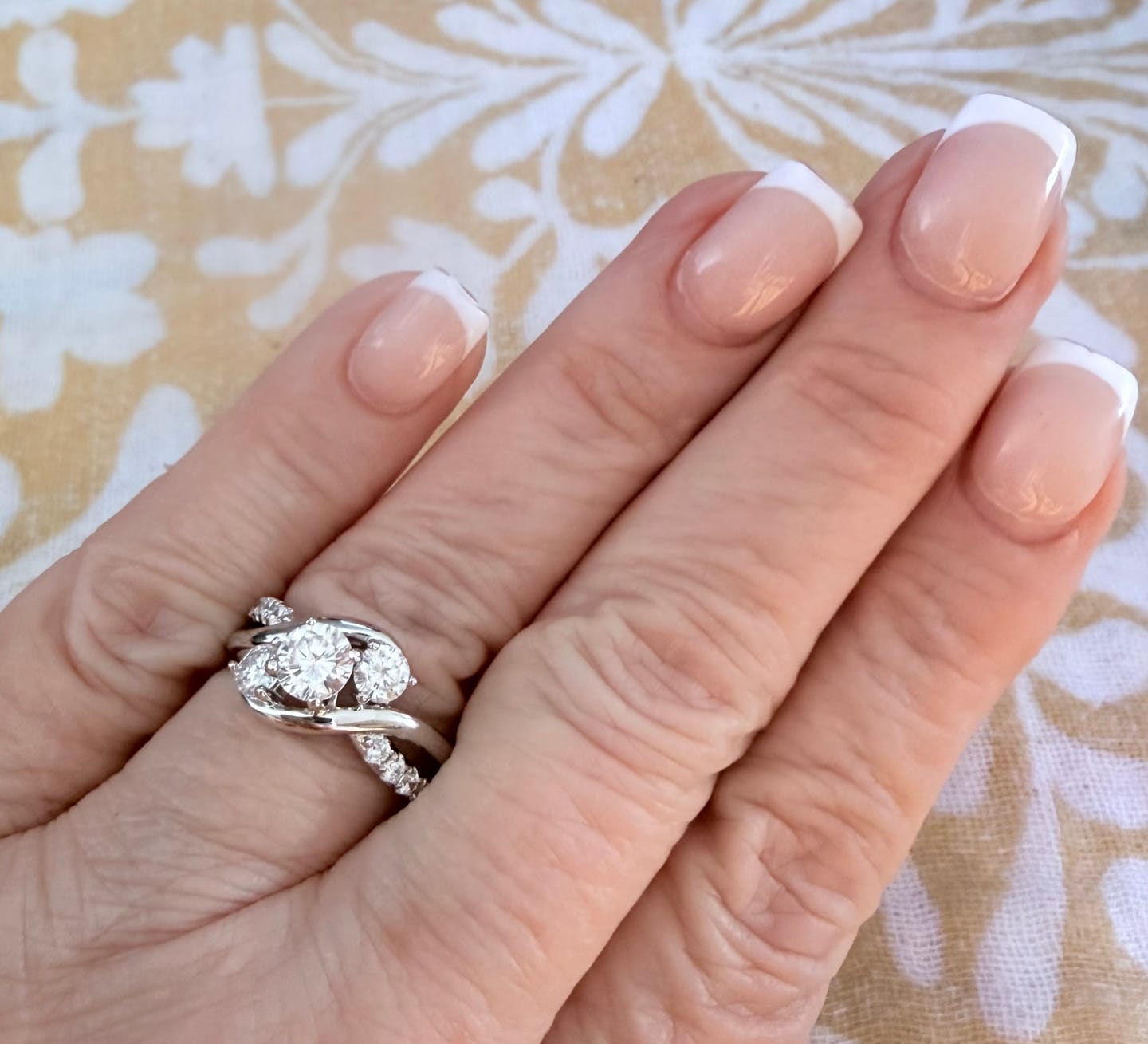 Customer photo review of Swirl Three Stone Moissanite Twisted Pave Engagement Ring