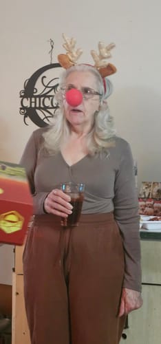 A customer dressed as a reindeer with a red nose and antlers for the Christmas Murder Mystery game.