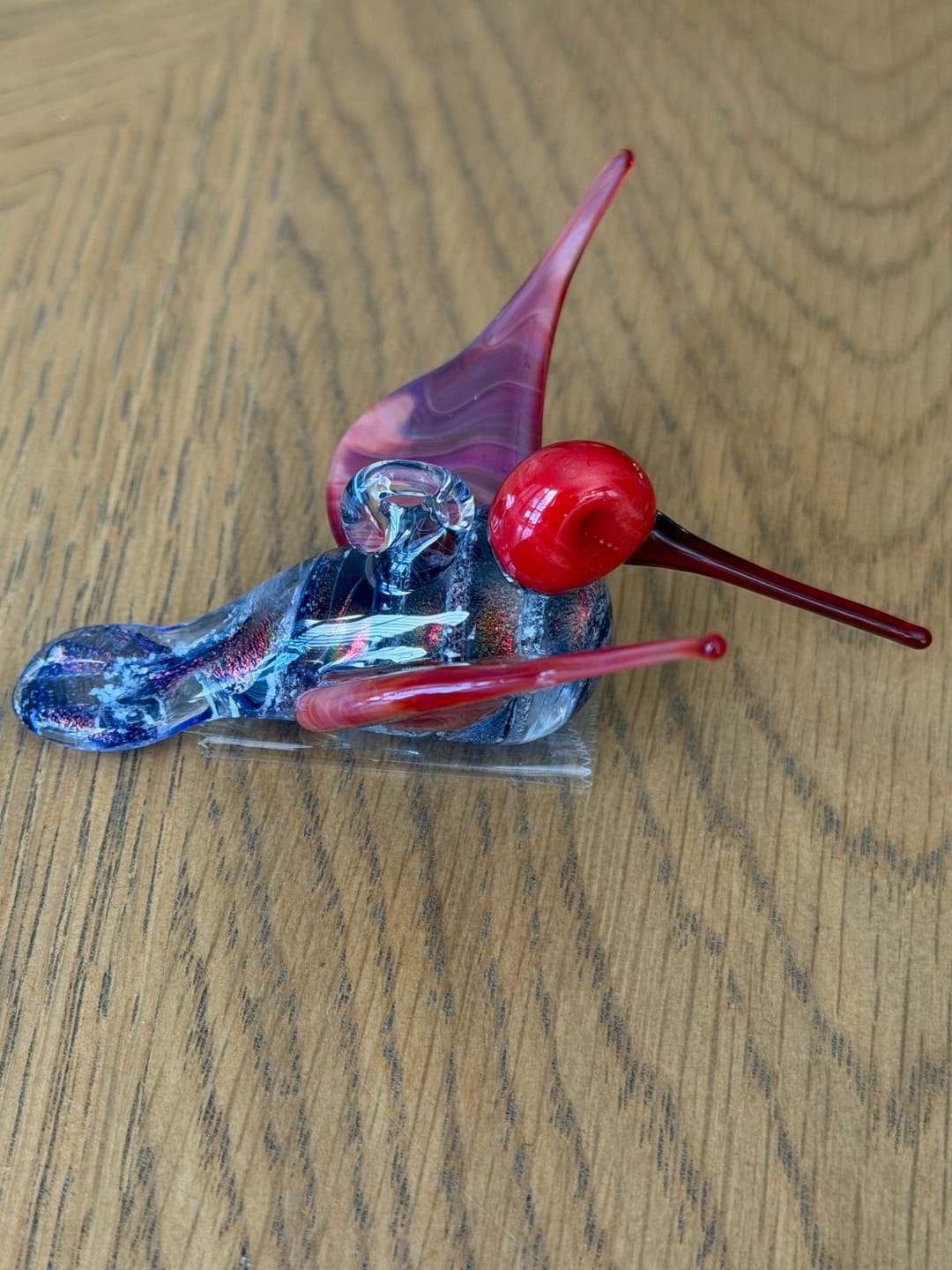 Customer photo review of Red Dichroic Twist Glass Hummingbird with Infused Ash
