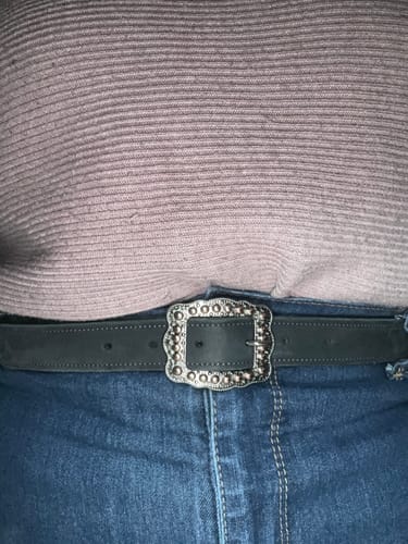 Customer wearing The Lennon Suede belt with blue jeans, showing the dark strap and ornate silver buckle.