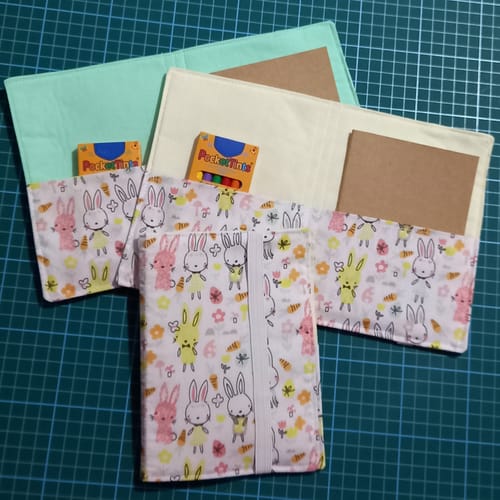 Customer's handmade drawing wallets created with the peach and yellow bunny polycotton fabric.