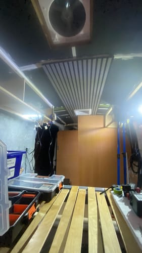 Customer's Premium Acoustic Slatted Wall Panels installed on the ceiling of a room under construction.