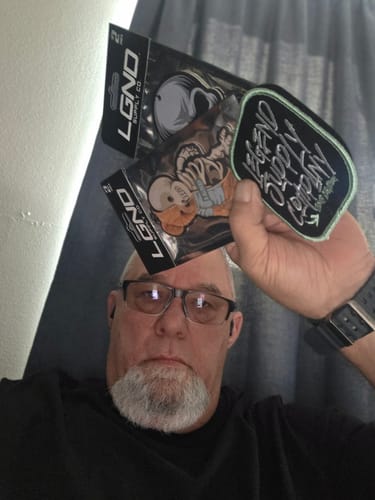 Customer holding up the Sub-Zero Air Freshener (2-Pack) in its original illustrated packaging.