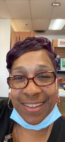 Close-up of the smiling reviewer who is happy with the Royal Cherry product.