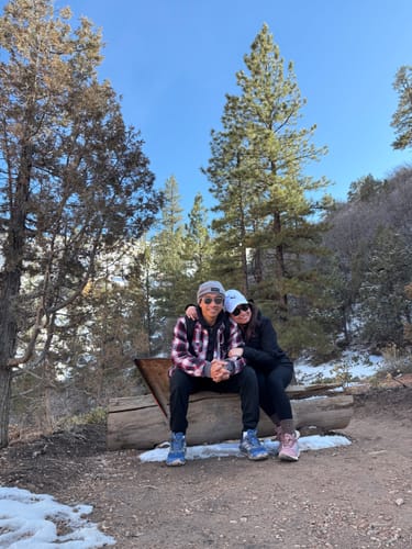 Customer and fiancé enjoying a moment in a snowy forest, as mentioned in their review for their custom song.