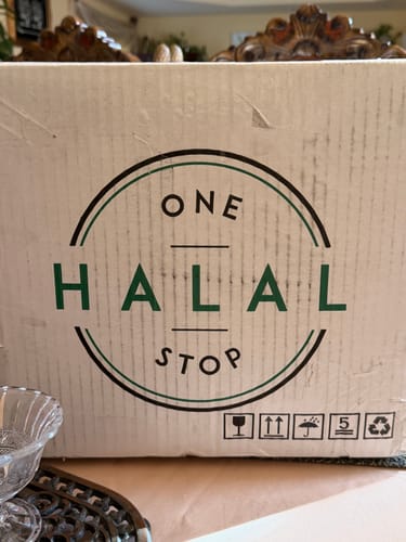 Customer's shipping box with the 'One Halal Stop' logo, containing their Halal Beef Tallow order.