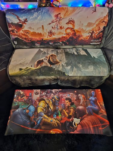 Customer's three custom iD Raid Boss mouse pads displayed together, featuring colorful game and movie scenes.